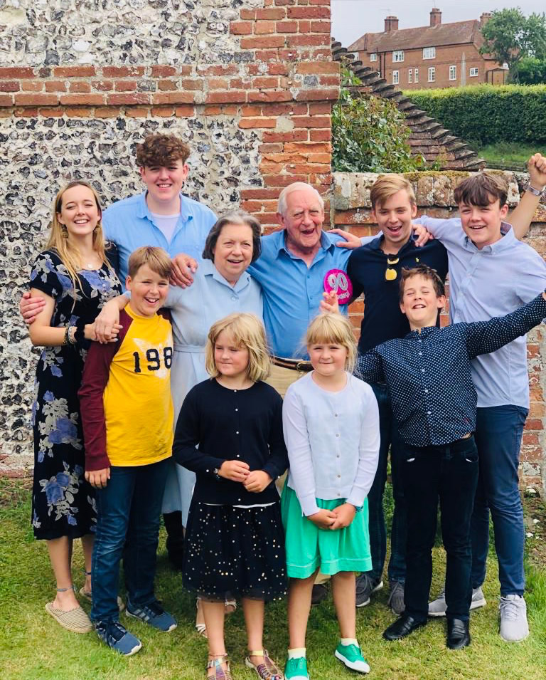 Obit - Ian MacPherson 90th Bday with wife Sally with all their grand children